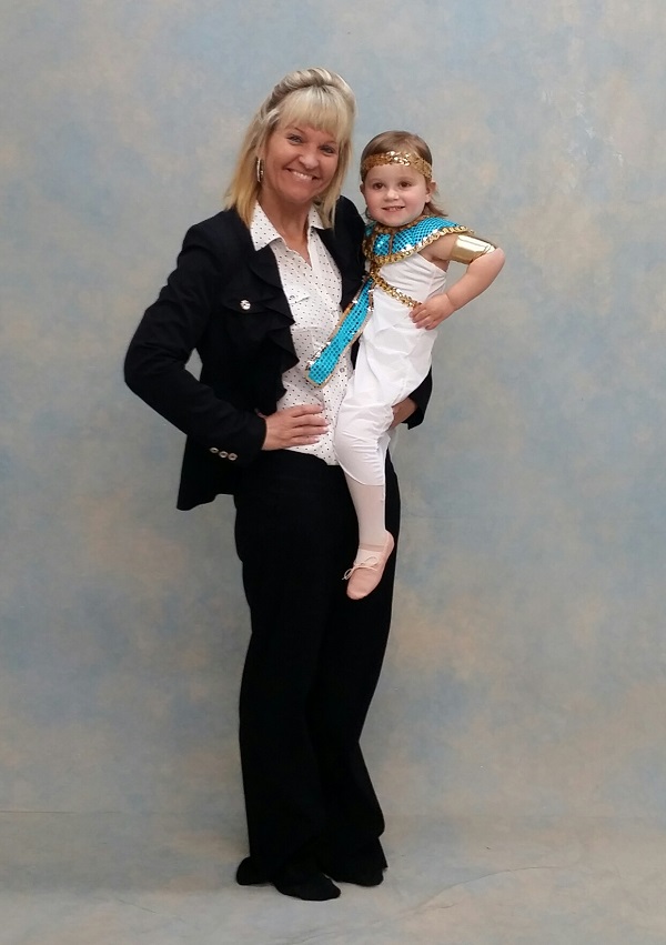 Miss Ann Marie poses with a dance student on photo day at AMA