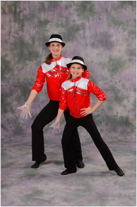 Siblings pose in their dance costumes at AMA Dance and Music School