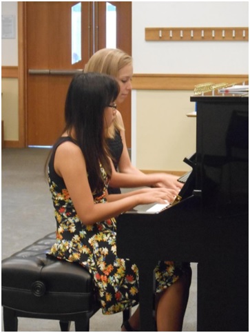 A piano duet at AMA Dance and Music School